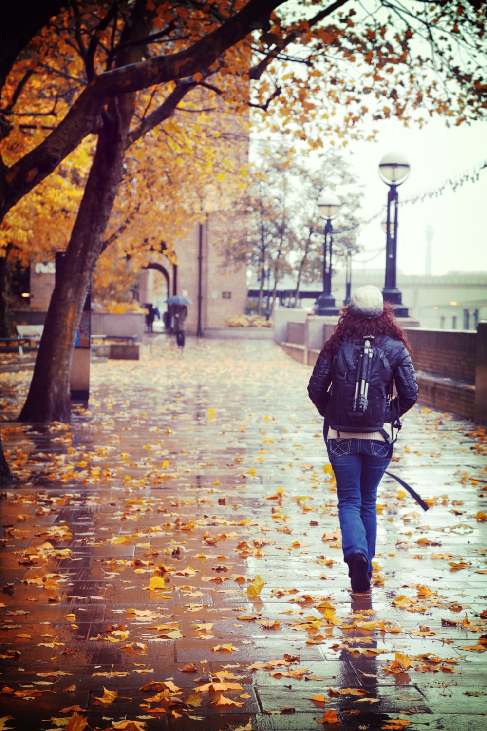 walking alongside the river thames in london