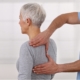 osteopath treating a woman's shoulder